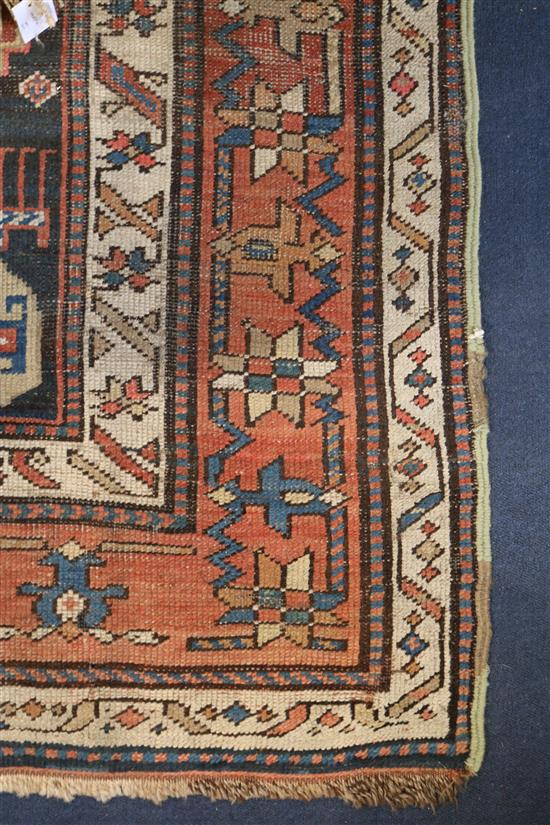 A Kazak blue ground runner, c.1880, 11ft 8in by 3ft 8in.